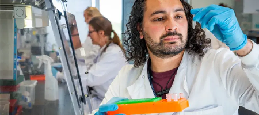 Student in lab with sample