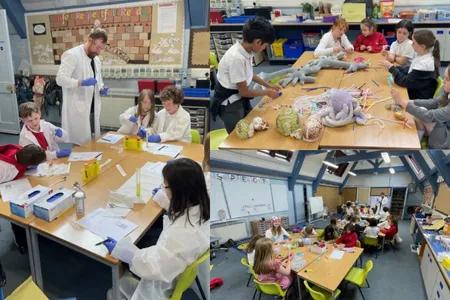 scientists with children in classroom setting