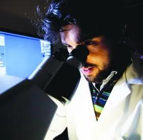 Microscope and scientist