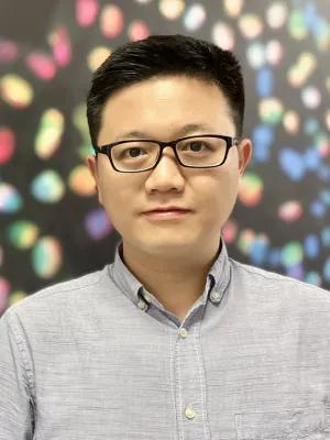 Man in front of spotty background